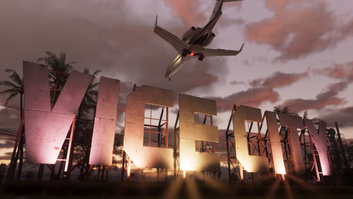 Het bord van Vice City bij zonsondergang, met een vliegtuig dat overvliegt